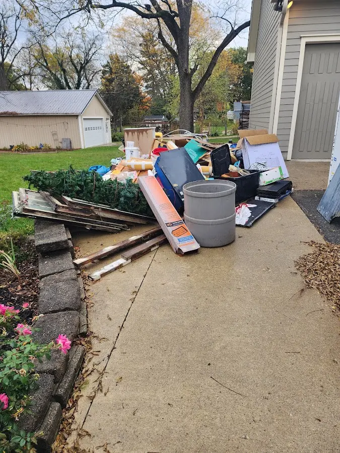 Dumpster being loaded with debris for Commercial Dumpster Rental in La Cresta